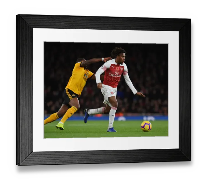 Framed Print : Alex Iwobi's Slick Moves: Outsmarting Ivan Cavaleiro at Emirates Stadium