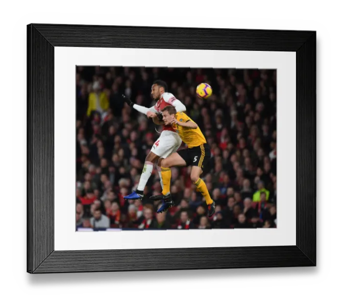 Framed Print : Aubameyang vs. Bennett: Intense Clash Between Arsenal's Star Striker and Wolves Defender