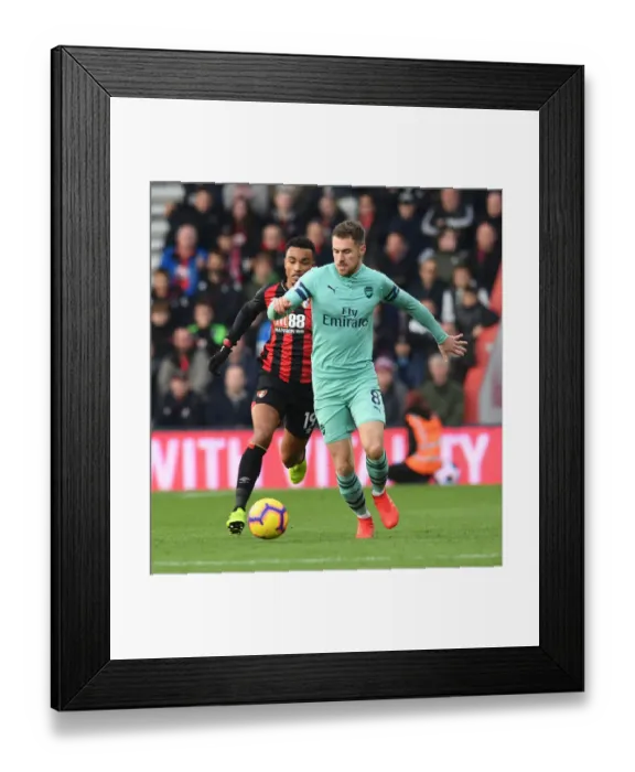 Framed Print : Arsenal's Aaron Ramsey Outmaneuvers Bournemouth's Junior Stanislas