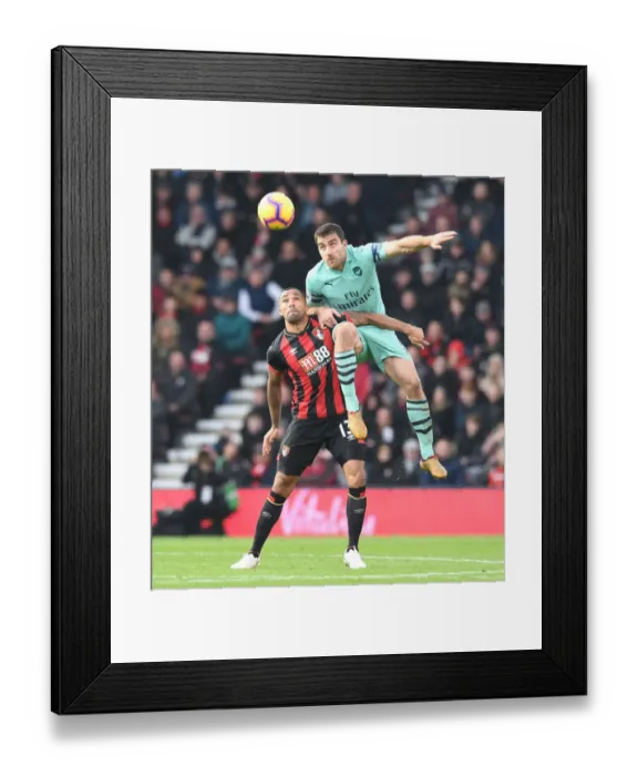 Framed Print : Sokratis vs. Wilson: Intense Battle in AFC Bournemouth vs. Arsenal FC Premier League Clash