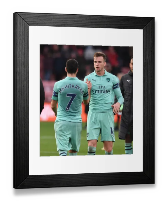 Framed Print : Arsenal's Mkhitaryan and Holding Celebrate Victory Over Bournemouth Framed Print : Arsenal's Mkhitaryan and Holding Celebrate Victory Over Bournemouth