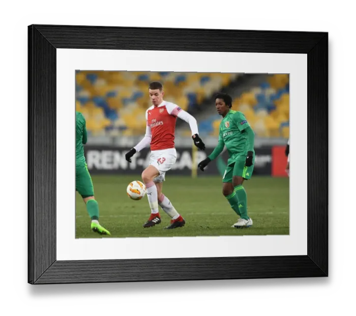 Framed Print : Clash in Ukraine: Gilmour vs. Kane in Arsenal's Europa League Battle with Vorskla Poltava Framed Print : Clash in Ukraine: Gilmour vs. Kane in Arsenal's Europa League Battle with Vorskla Poltava