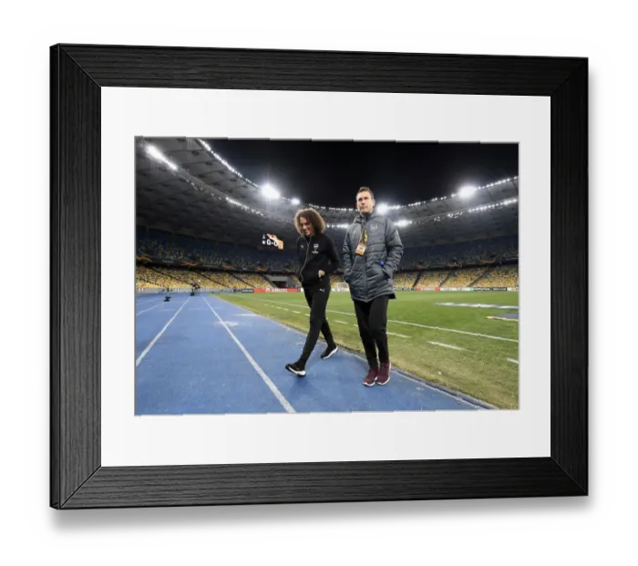Framed Print : Arsenal Players Matteo Guendouzi and Stephan Lichtsteiner Scout Pitch before Vorskla Poltava Match Framed Print : Arsenal Players Matteo Guendouzi and Stephan Lichtsteiner Scout Pitch before Vorskla Poltava Match