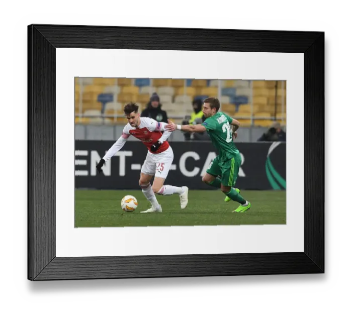 Framed Print : Clash of Forces: Jenkinson vs. Kolomoets in Arsenal's Europa League Battle against Vorskla Poltava Framed Print : Clash of Forces: Jenkinson vs. Kolomoets in Arsenal's Europa League Battle against Vorskla Poltava