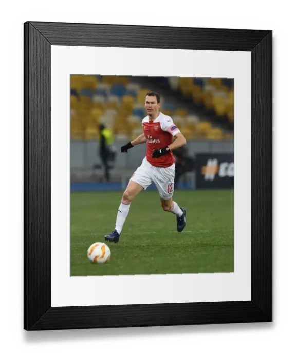 Framed Print : Stephan Lichtsteiner in Action: Arsenal's Europa League Battle against Vorskla Poltava Framed Print : Stephan Lichtsteiner in Action: Arsenal's Europa League Battle against Vorskla Poltava