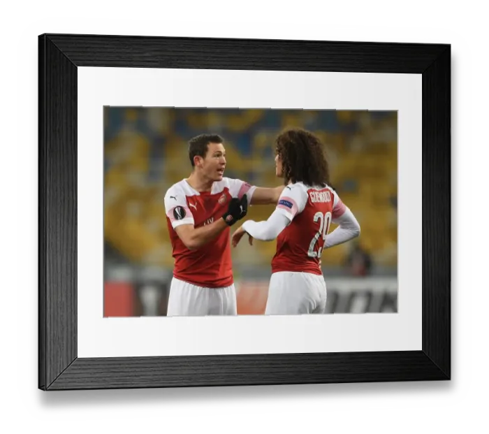 Framed Print : Arsenal's Guendouzi and Lichtsteiner in Action against Vorskla Poltava in Europa League