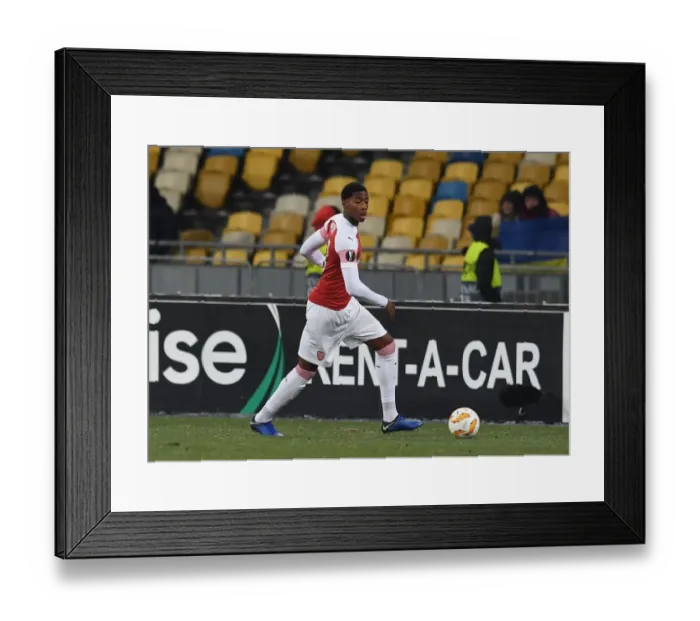 Framed Print : Zech Medley in Action: Arsenal's Europa League Battle against Vorskla Poltava