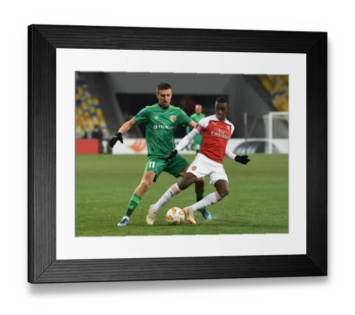 Framed Print : Arsenal's Joe Willock Faces Off Against Vyacheslav Sharpar in Europa League Clash Framed Print : Arsenal's Joe Willock Faces Off Against Vyacheslav Sharpar in Europa League Clash