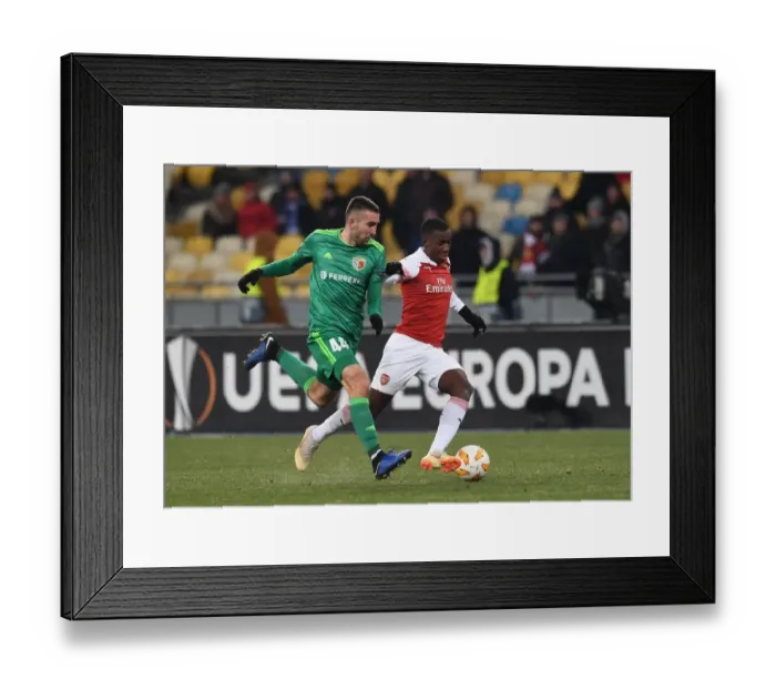 Framed Print : Arsenal's Eddie Nketiah Goes Head-to-Head with Ardin Dallku in UEFA Europa League Clash