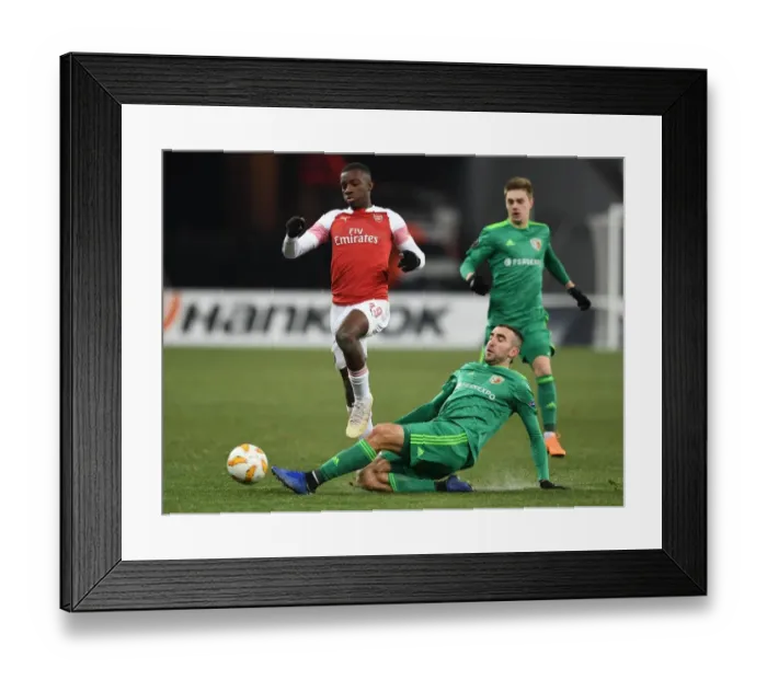 Framed Print : Arsenal's Eddie Nketiah Clashes with Ardin Dallku in Intense Europa League Encounter Framed Print : Arsenal's Eddie Nketiah Clashes with Ardin Dallku in Intense Europa League Encounter