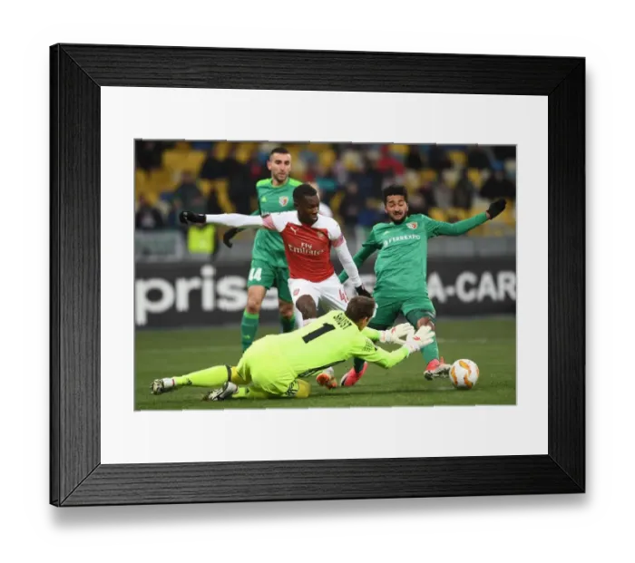 Framed Print : Arsenal's Eddie Nketiah Faces Off Against Vorskla Duo in Europa League Clash