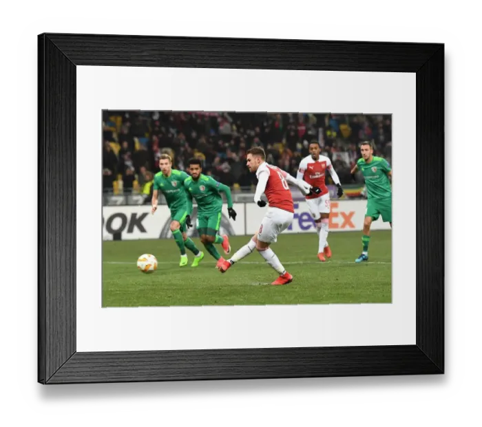 Framed Print : Aaron Ramsey Scores Penalty: Arsenal's Victory over Vorskla Poltava in Europa League