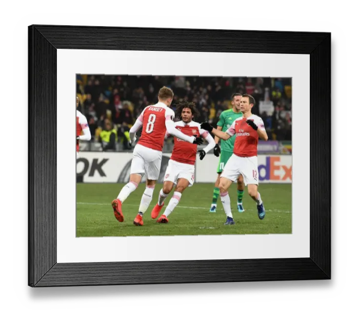 Framed Print : Arsenal's Aaron Ramsey, Mohamed Elneny, and Stephan Lichtsteiner Celebrate Goals Against Vorskla Poltava in Europa League Framed Print : Arsenal's Aaron Ramsey, Mohamed Elneny, and Stephan Lichtsteiner Celebrate Goals Against Vorskla Poltava in Europa League
