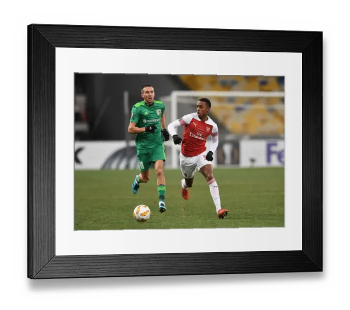 Framed Print : Joe Willock vs. Vyacheslav Sharpar: Clash in the Europa League between Arsenal's Young Gun and FC Vorskla Poltava's Defender Framed Print : Joe Willock vs. Vyacheslav Sharpar: Clash in the Europa League between Arsenal's Young Gun and FC Vorskla Poltava's Defender