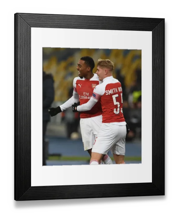 Framed Print : Joe Willock and Emile Smith Rowe Celebrate Goals in Arsenal's UEFA Europa League Victory over Vorskla Poltava