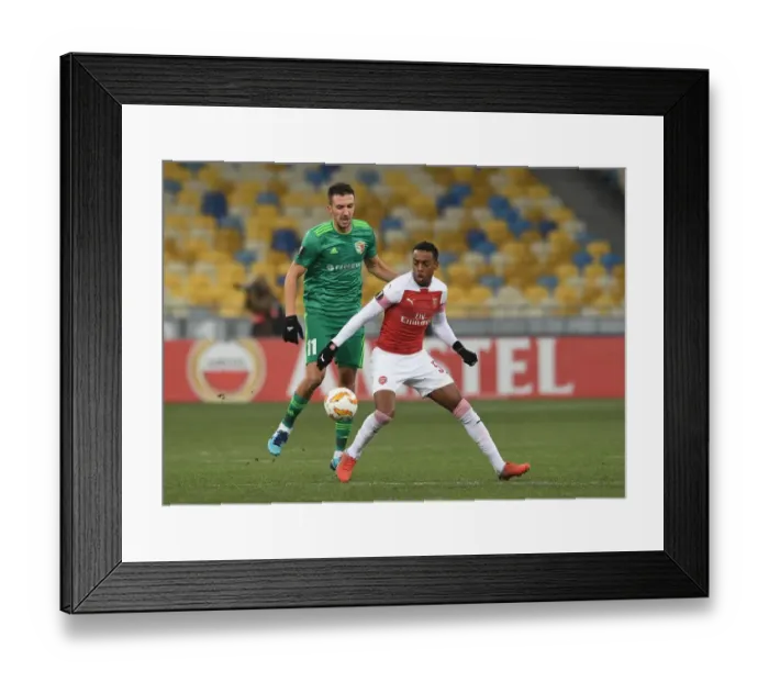 Framed Print : Joe Willock vs. Vyacheslav Sharpar: Intense Clash in Arsenal's Europa League Battle against Vorskla Poltava Framed Print : Joe Willock vs. Vyacheslav Sharpar: Intense Clash in Arsenal's Europa League Battle against Vorskla Poltava