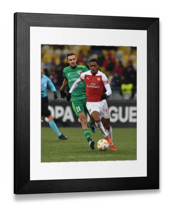 Framed Print : Joe Willock vs. Vyacheslav Sharpar: Clash in the Europa League between Arsenal and Vorskla Poltava
