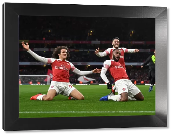 Arsenal's Triumph: Lacazette, Guendouzi, and Kolasinac Celebrate Goals Against Tottenham