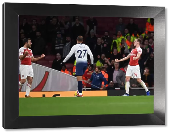 Arsenal Celebrate Derby Victory: Sokratis and Holding Rejoice after Beating Tottenham