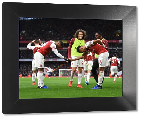 Arsenal's Lacazette and Aubameyang: Unstoppable Duo Celebrates Goals Against Tottenham in the 2018-19 Premier League Clash