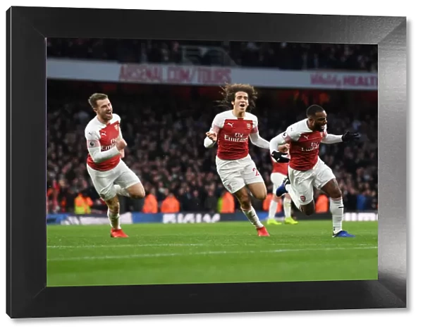 Arsenal's Lacazette, Ramsey, and Guendouzi Celebrate Goals Against Tottenham in 2018-19 Premier League