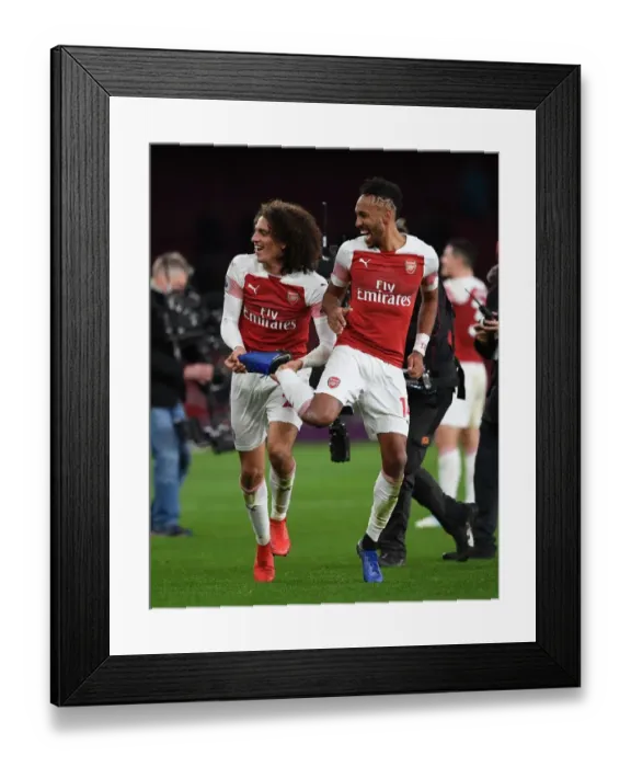 Framed Print : Arsenal's Guendouzi and Aubameyang Celebrate Victory Over Tottenham