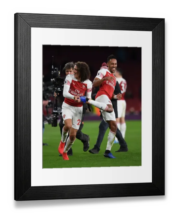 Framed Print : Arsenal's Guendouzi and Aubameyang: Celebrating a Hard-Fought Victory Over Tottenham Framed Print : Arsenal's Guendouzi and Aubameyang: Celebrating a Hard-Fought Victory Over Tottenham
