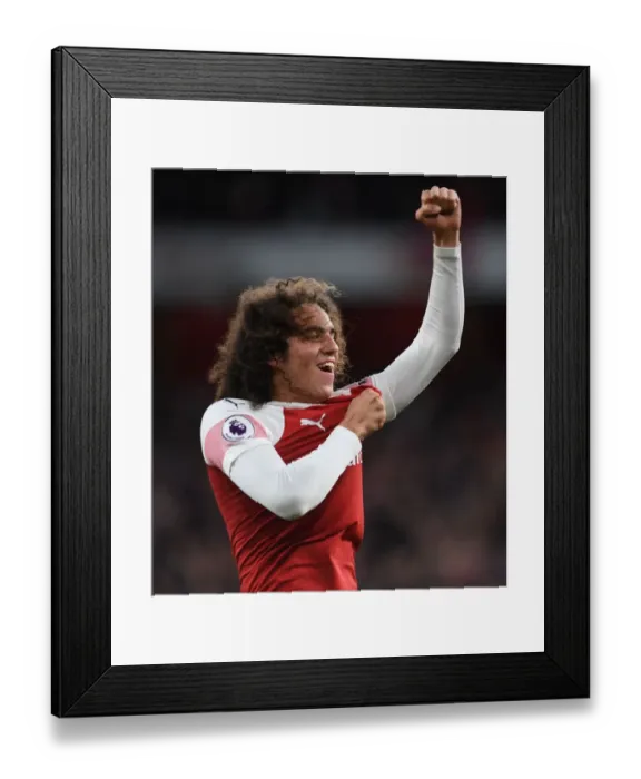 Framed Print : Guendouzi's Euphoria: Arsenal's Thrilling Victory Over Tottenham in the Premier League