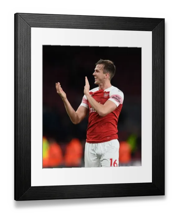 Framed Print : Arsenal's Rob Holding Celebrates Derby Win with Ardent Fans