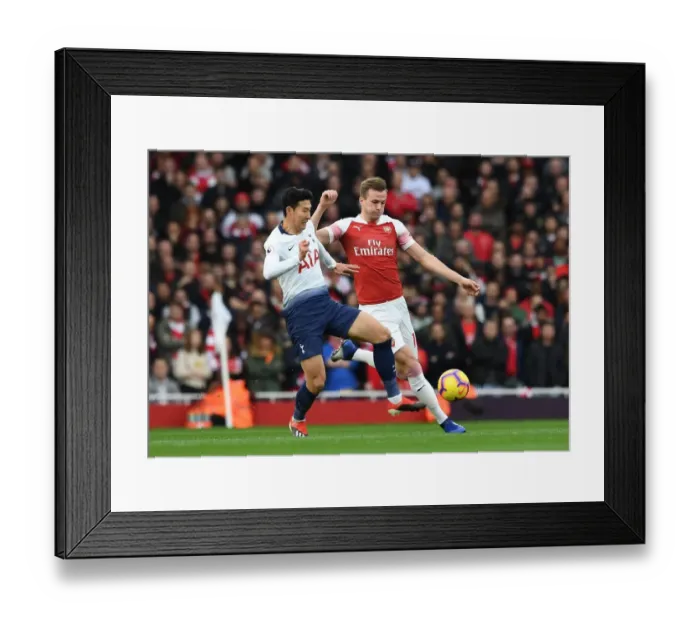 Framed Print : Clash at the Emirates: Holding vs. Son in the Arsenal vs. Tottenham Premier League Battle