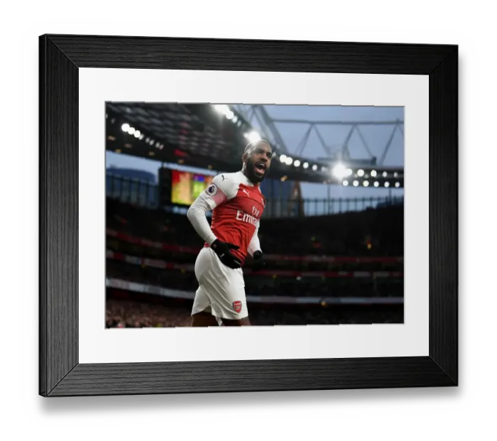 Framed Print : Arsenal's Alexandre Lacazette Goes Head-to-Head with Tottenham in Intense Premier League Showdown