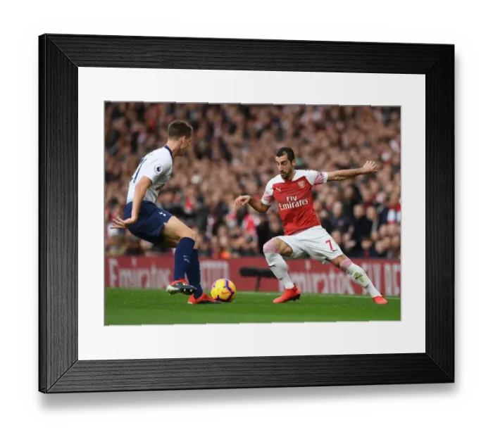 Framed Print : Arsenal's Mkhitaryan Clashes with Tottenham's Foyth in Intense Premier League Showdown