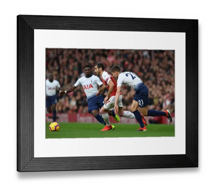 Framed Print : Arsenal's Mkhitaryan Clashes with Tottenham's Aurier and Foyth in Premier League Showdown