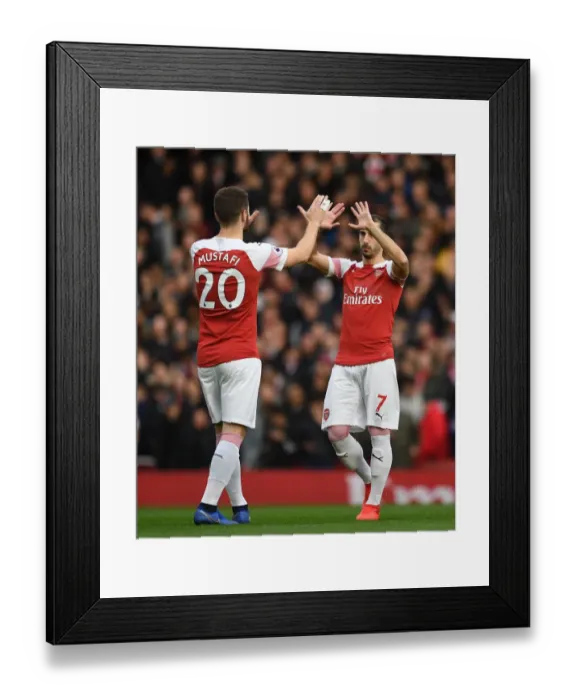 Framed Print : Arsenal: Mustafi and Mkhitaryan's High-Five Moment before the Battle against Tottenham