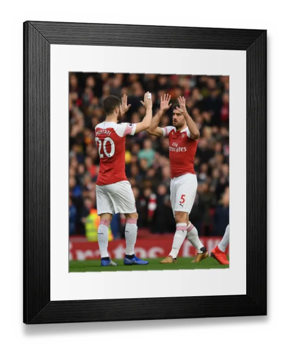 Framed Print : Arsenal's Sokratis and Mustafi Share a Moment Before the Arsenal v Tottenham Clash Framed Print : Arsenal's Sokratis and Mustafi Share a Moment Before the Arsenal v Tottenham Clash