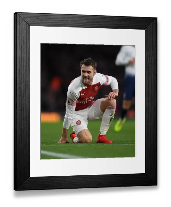 Framed Print : Arsenal's Aaron Ramsey Faces Off Against Tottenham in Premier League Showdown