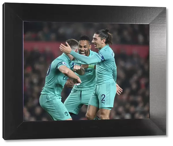 Arsenal's Mustafi, Aubameyang, and Bellerin: Celebrating a Goal Against Manchester United (2018-19)