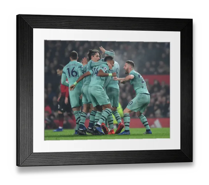 Framed Print : Mustafi, Aubameyang, and Bellerin Celebrate Arsenal's Goal Against Manchester United (2018-19)