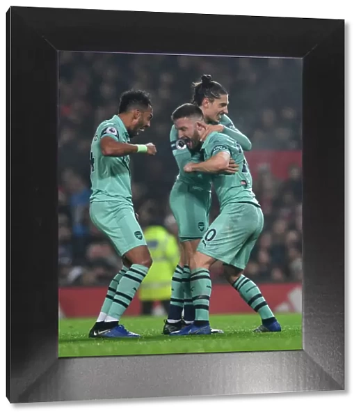 Arsenal's Triumph: Mustafi, Aubameyang, and Bellerin Celebrate First Goal Against Manchester United (2018-19)