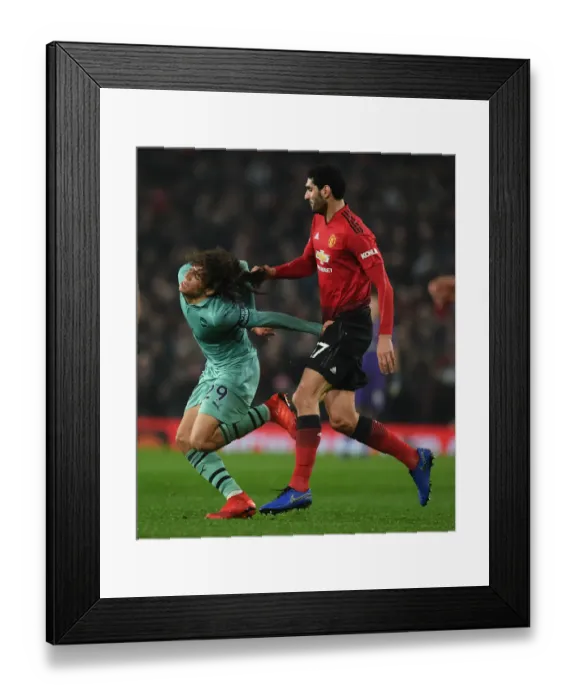 Framed Print : Fellaini vs. Guendouzi: Heading Clash in Manchester United vs. Arsenal FC Premier League Match Framed Print : Fellaini vs. Guendouzi: Heading Clash in Manchester United vs. Arsenal FC Premier League Match