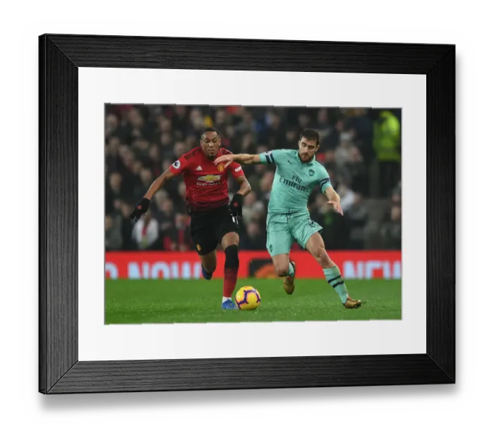 Framed Print : Manchester United vs. Arsenal: Sokratis vs. Anthony Martial - Intense Battle in the Premier League