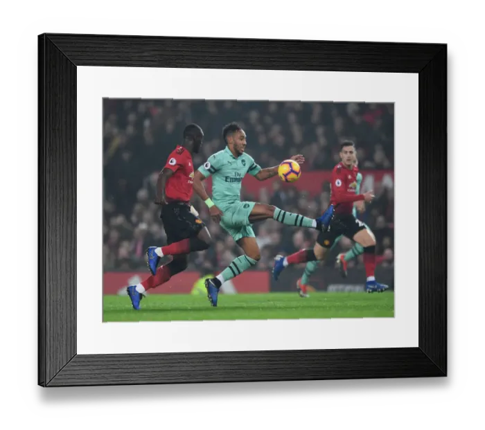 Framed Print : Aubameyang vs. Bailly: A Premier League Showdown at Old Trafford