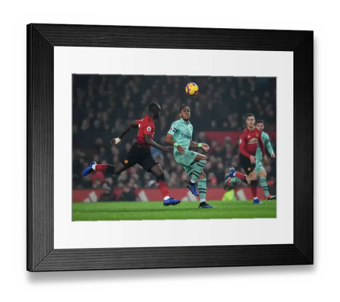 Framed Print : Aubameyang vs. Bailly: Intense Battle at Old Trafford - Manchester United vs. Arsenal FC, Premier League 2018-19