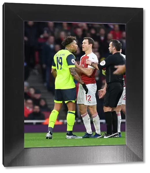 Clash of the Titans: Lichtsteiner vs. Williams in Arsenal's Battle Against Huddersfield