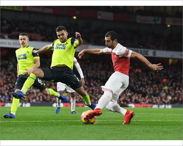 Arsenal's Mkhitaryan Clashes with Huddersfield's Smith in Premier League Showdown