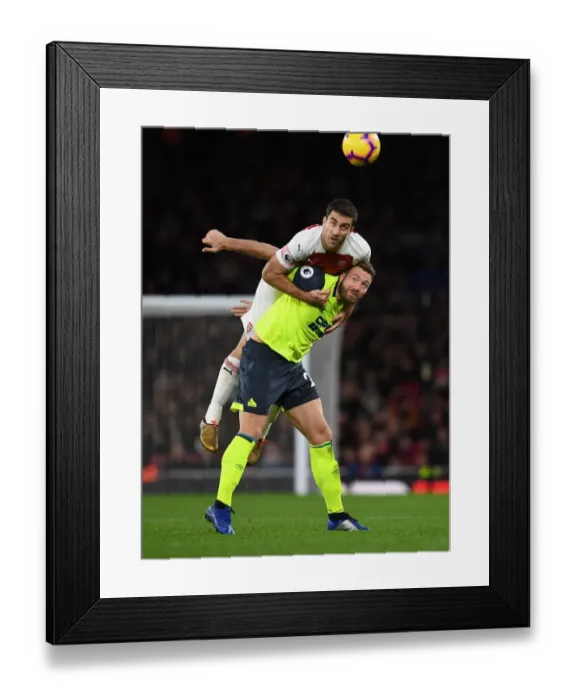Framed Print : Sokratis vs. Depoitre: Intense Clash Between Arsenal and Huddersfield Players