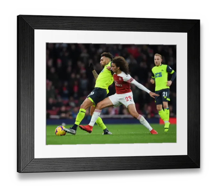 Framed Print : Guendouzi vs Williams: Intense Clash Between Arsenal's Matteo Guendouzi and Huddersfield's Danny Williams in the Premier League Framed Print : Guendouzi vs Williams: Intense Clash Between Arsenal's Matteo Guendouzi and Huddersfield's Danny Williams in the Premier League
