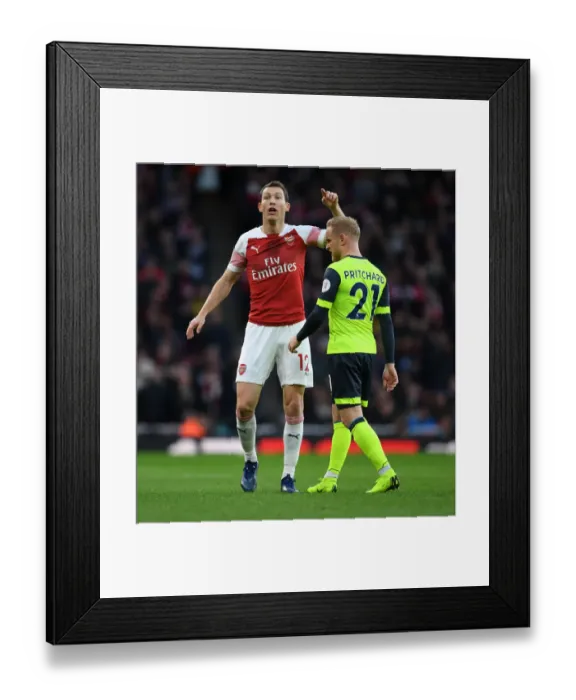 Framed Print : Arsenal's Lichtsteiner Marks Huddersfield's Pritchard in Premier League Clash Framed Print : Arsenal's Lichtsteiner Marks Huddersfield's Pritchard in Premier League Clash