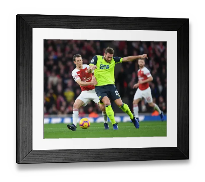 Framed Print : Arsenal vs. Huddersfield: Lichtsteiner vs. Depoitre in Intense Premier League Clash
