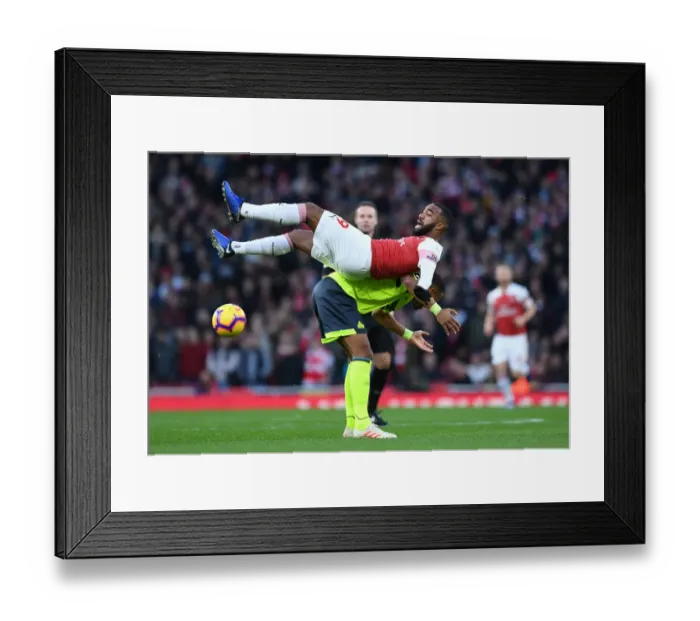 Framed Print : Arsenal's Lacazette Tangles with Huddersfield's Jorgensen in Premier League Clash